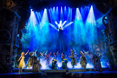 Production shot of Wicked cast on stage