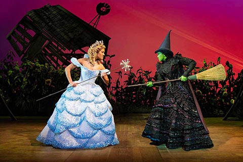 Production shot of Wicked cast on stage